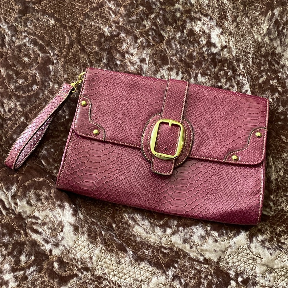 Large magenta clutch with gold accents